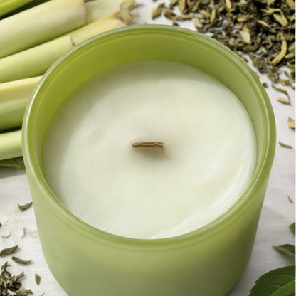 Green 'zen' candle with decorative elements on a white background