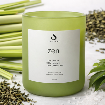 Green candle labeled 'zen' with a white label on a white background with greenery.