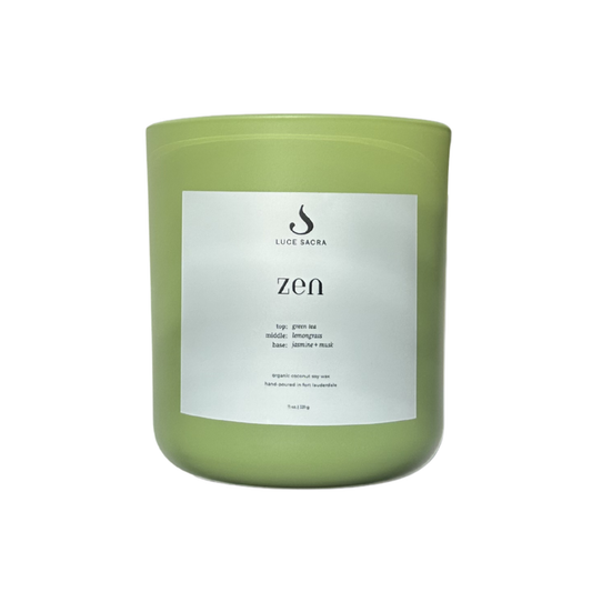 Green candle with a label on a white background